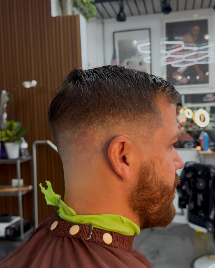 Classic taper paired with a full auburn beard trim at Alchemy Hair Lab