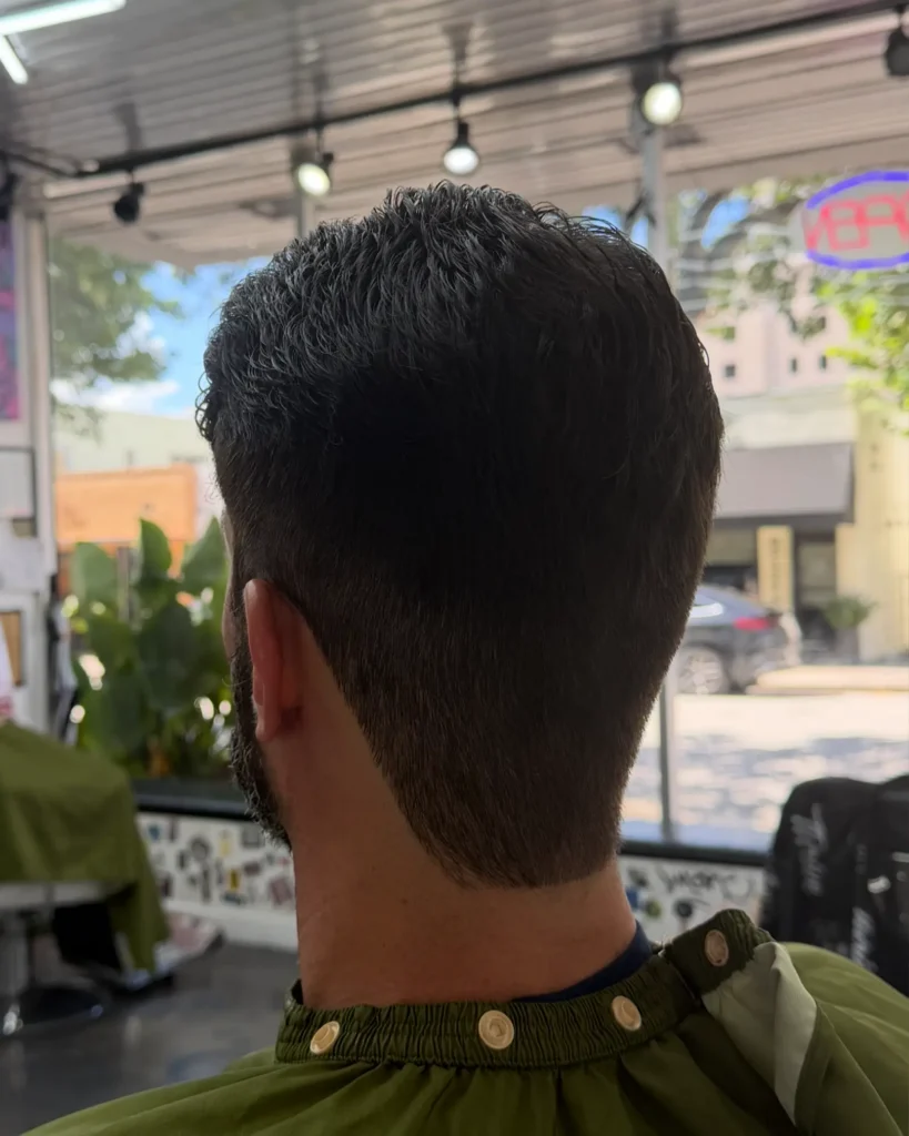 Back view of a tapered neckline on a natural taper haircut, Coral Gables barbershop