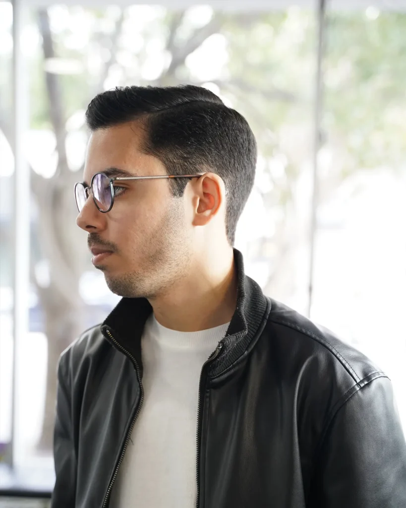 Classic side part with tapered sides, cut by Luis Mosquera