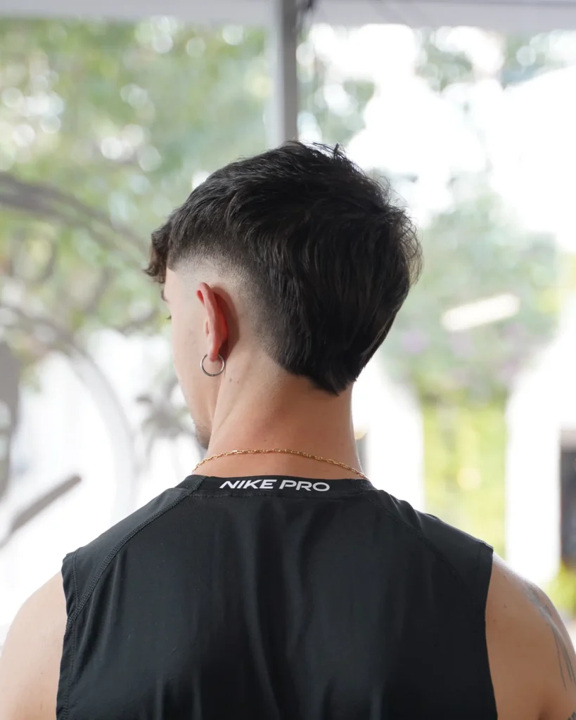 Back view of a drop fade mullet, cut by Luis Mosquera
